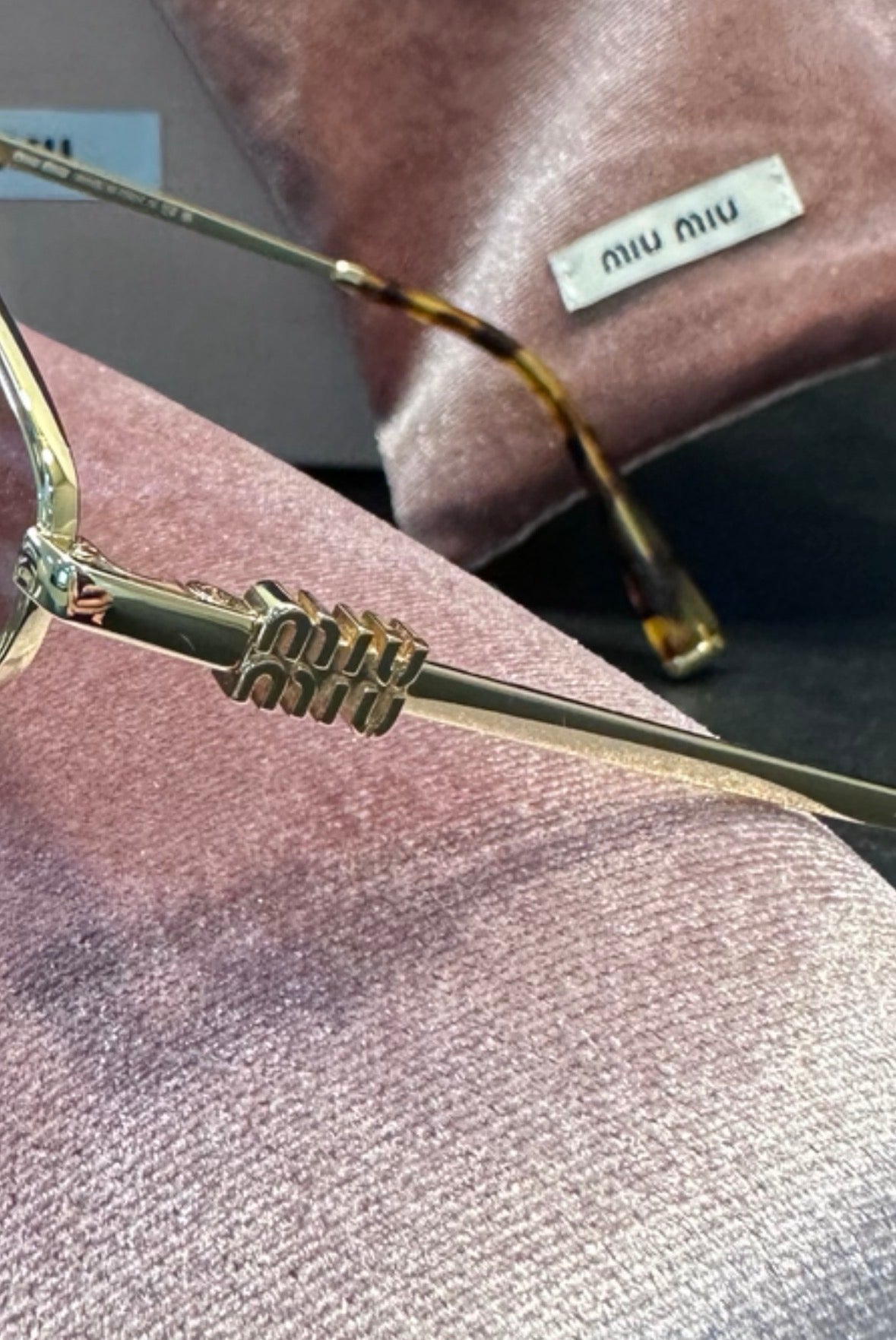 Miu Miu Sonnenbrille in Violett/Gold