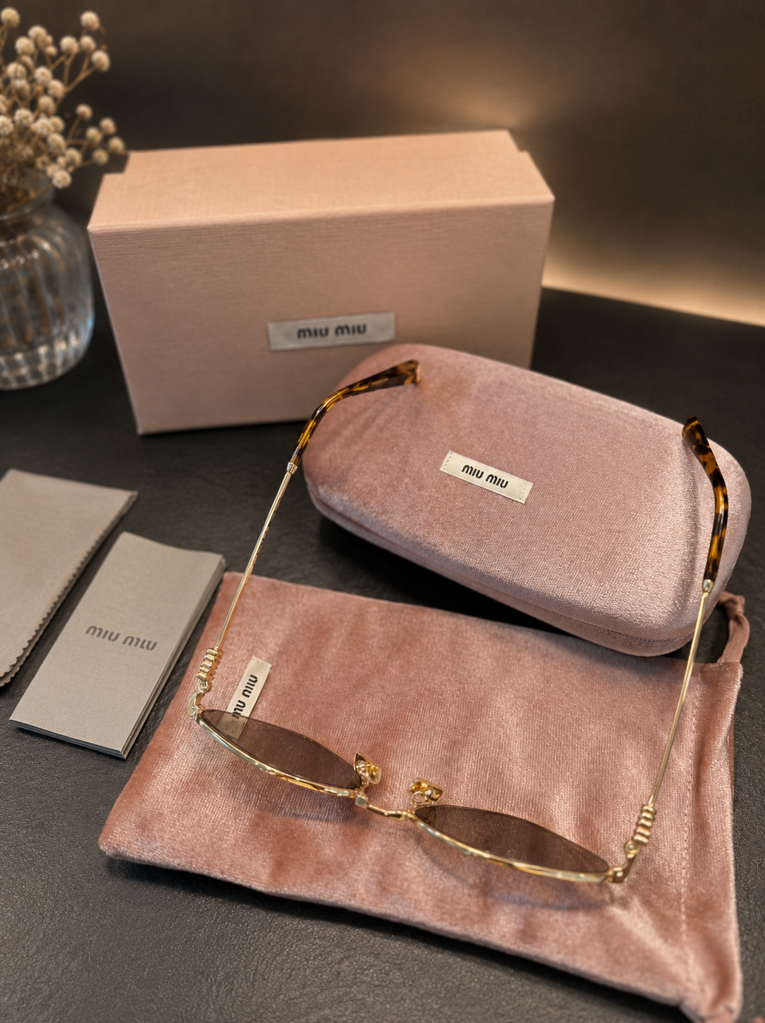 Miu Miu Sonnenbrille in Violett/Gold