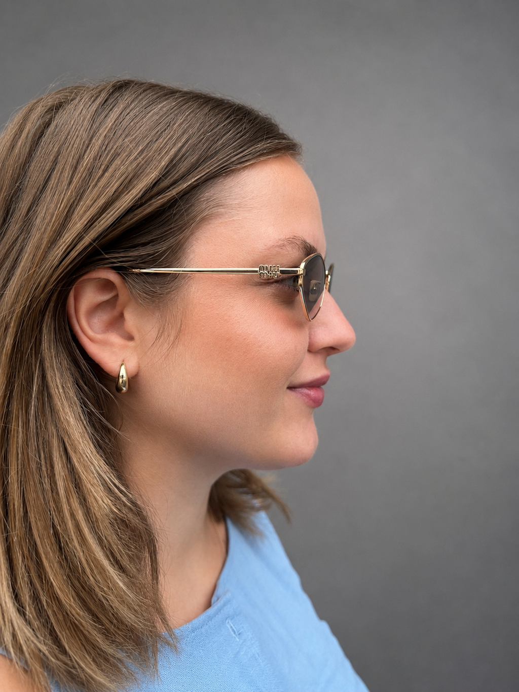 Miu Miu Sonnenbrille in Violett/Gold